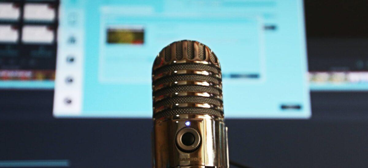 selective focus photography of gray stainless steel condenser microphone