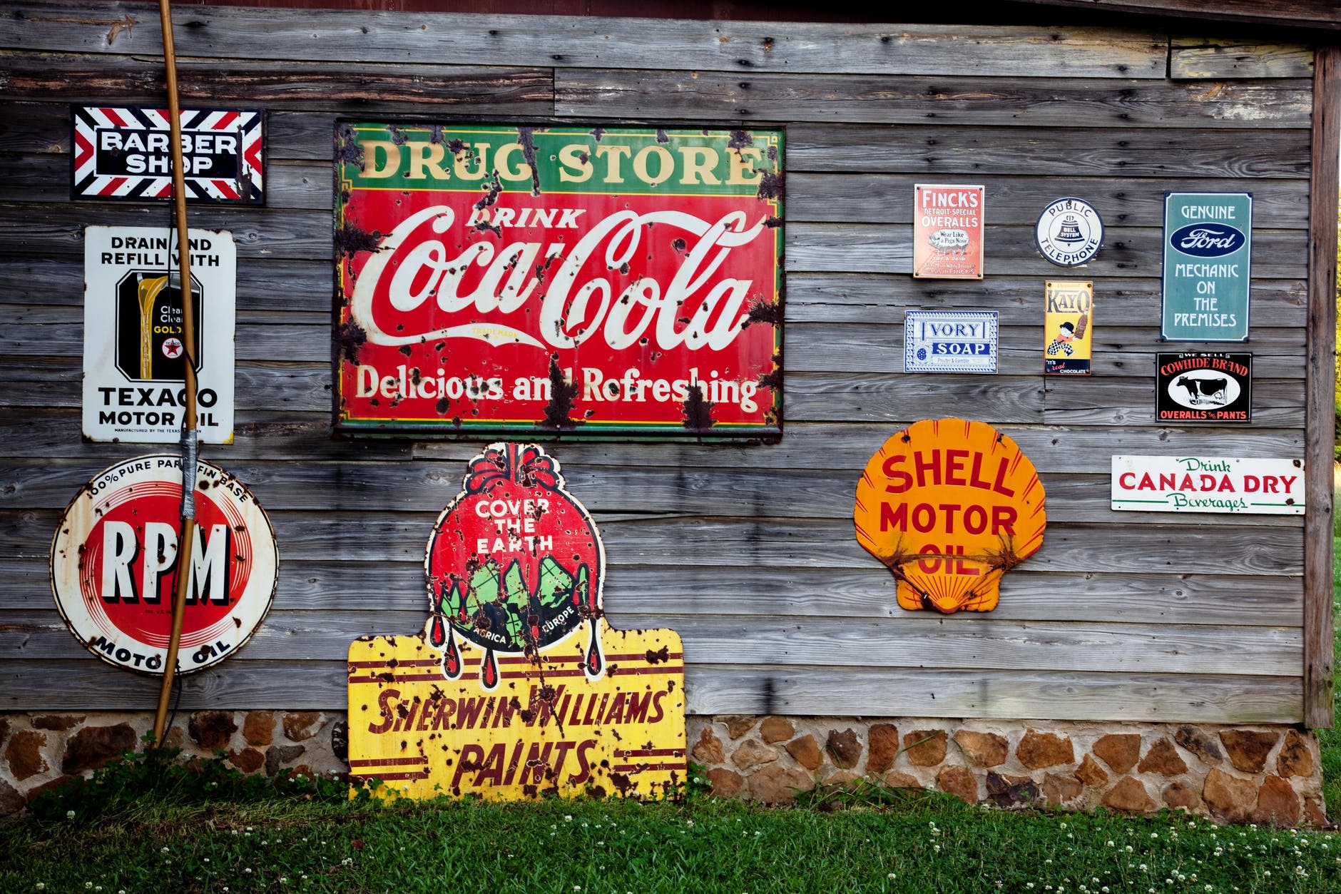 Photo by Pixabay on Pexels.com drug store drink coca cola signage on gray wooden wall