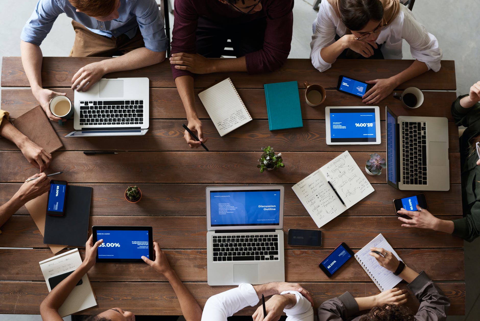 Photo by fauxels on Pexels.com top view photo of people near wooden table