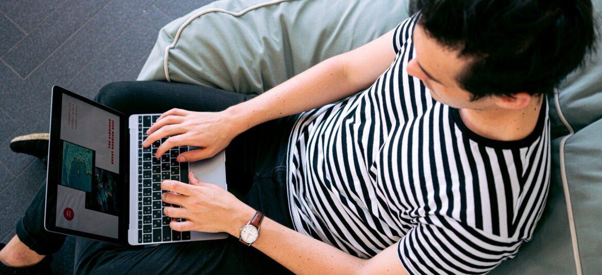 photo of man using laptop