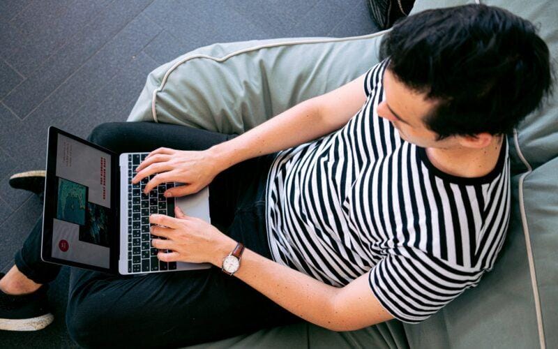 photo of man using laptop