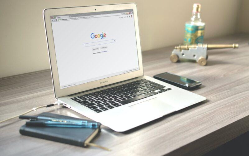 macbook air on grey wooden table