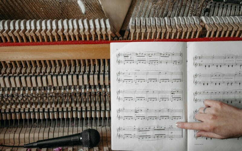 music book on a wooden piano