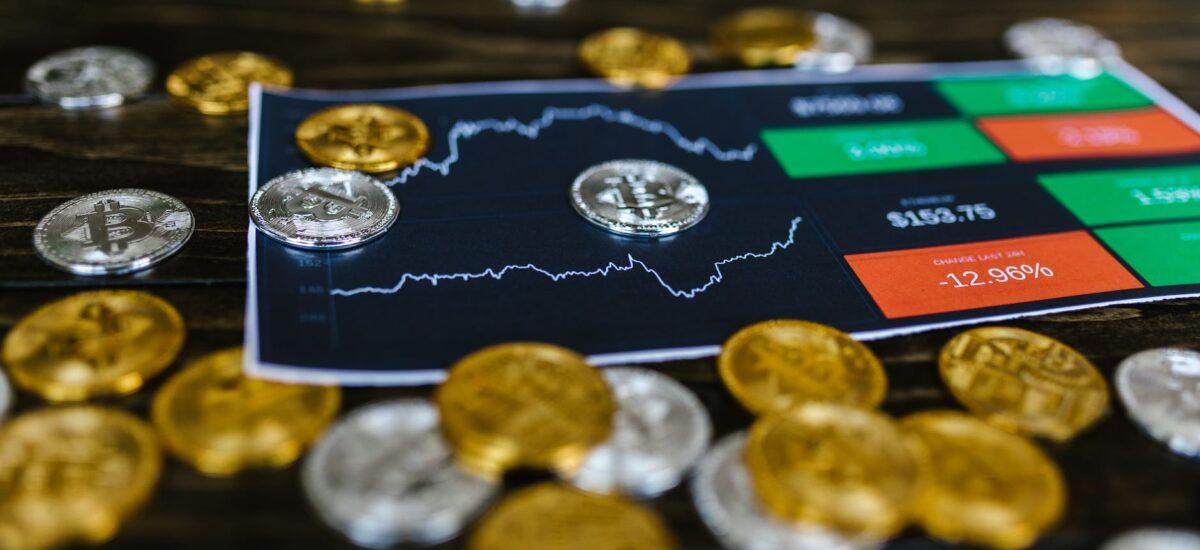 selective focus photo of silver and gold bitcoins