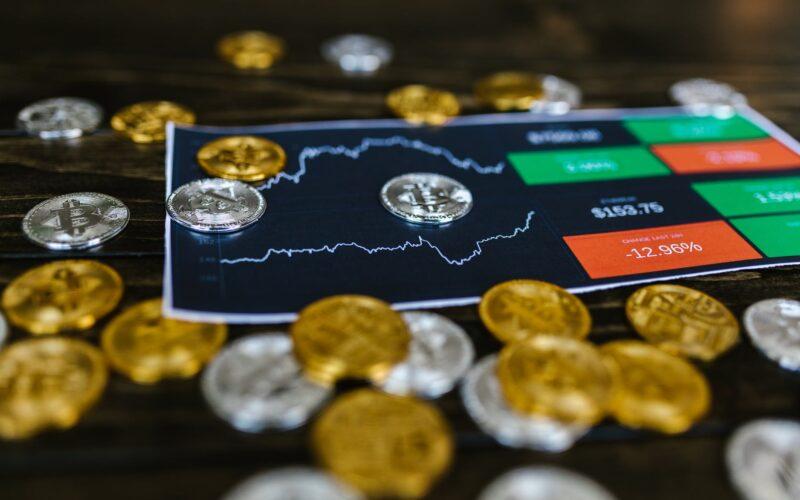 selective focus photo of silver and gold bitcoins